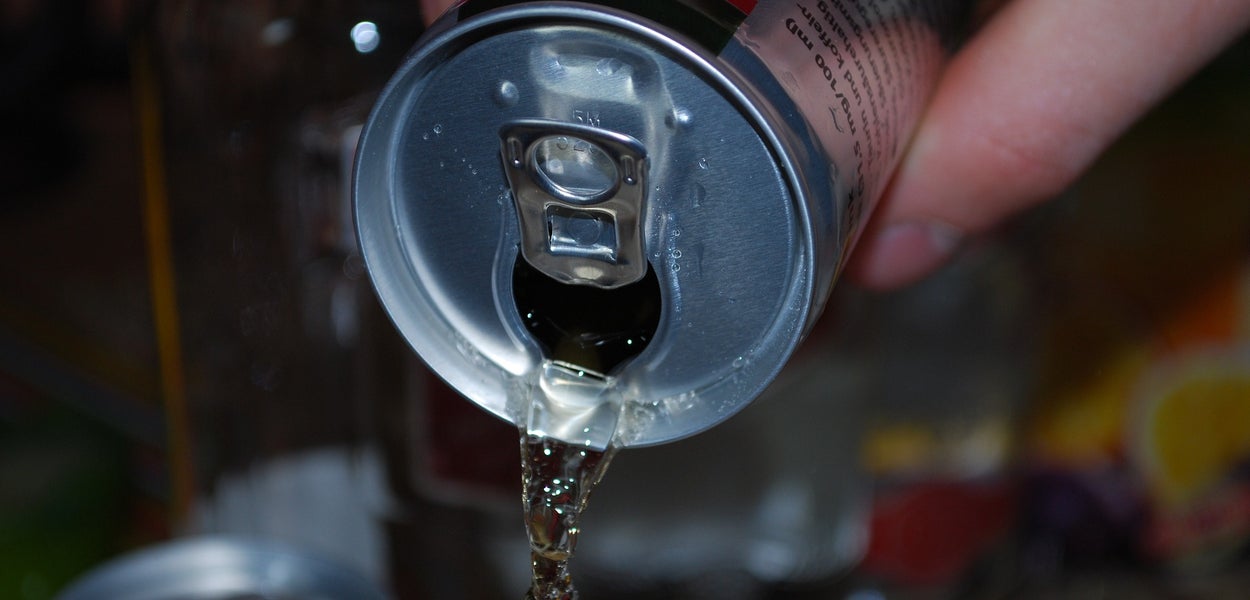 Soft drink is poured from a can