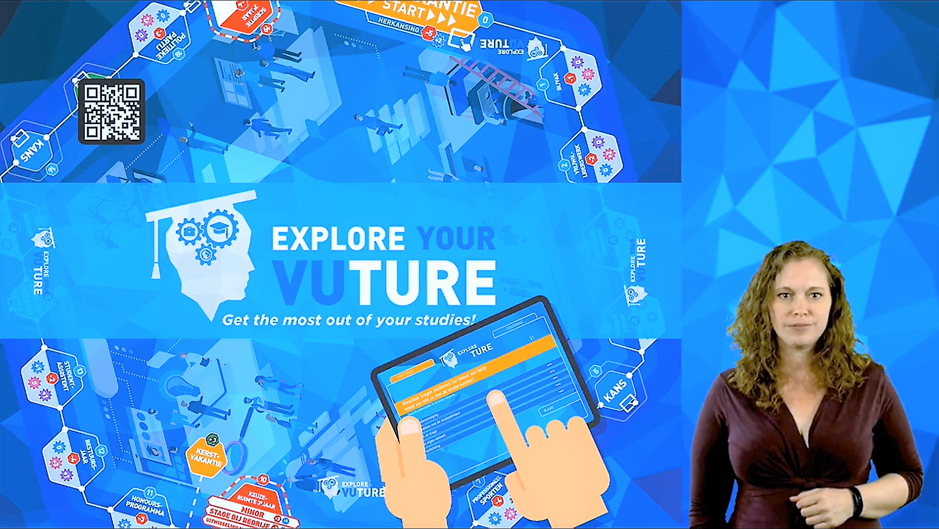 Video still: Nadia in front of the Explore Your VUture game board, explaining the game rules