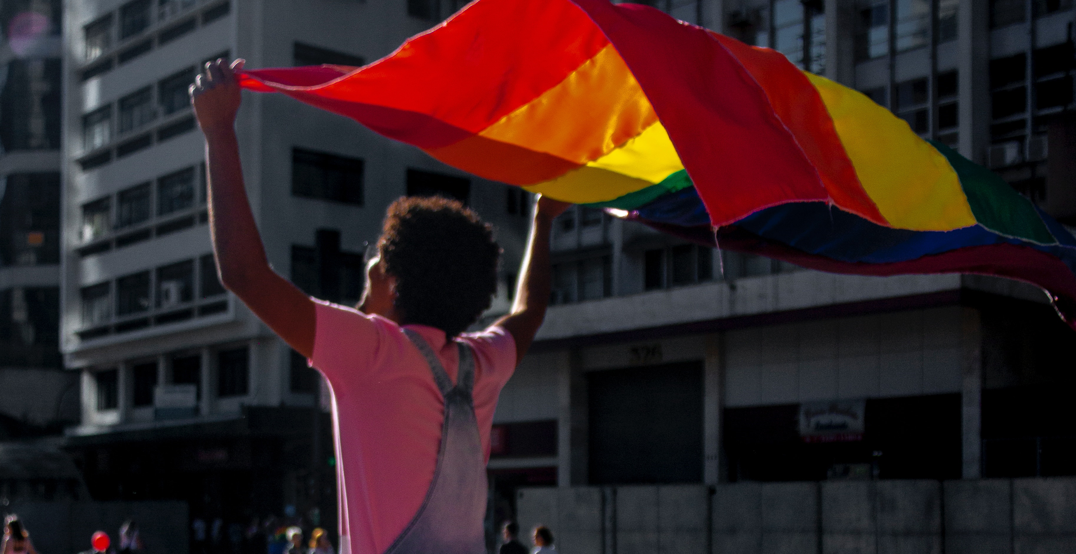 Woman with a LGBT-flag.