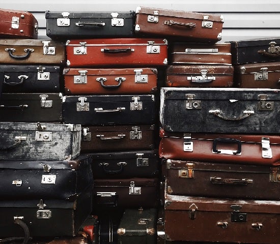 Close-up of a stack of old suitcases