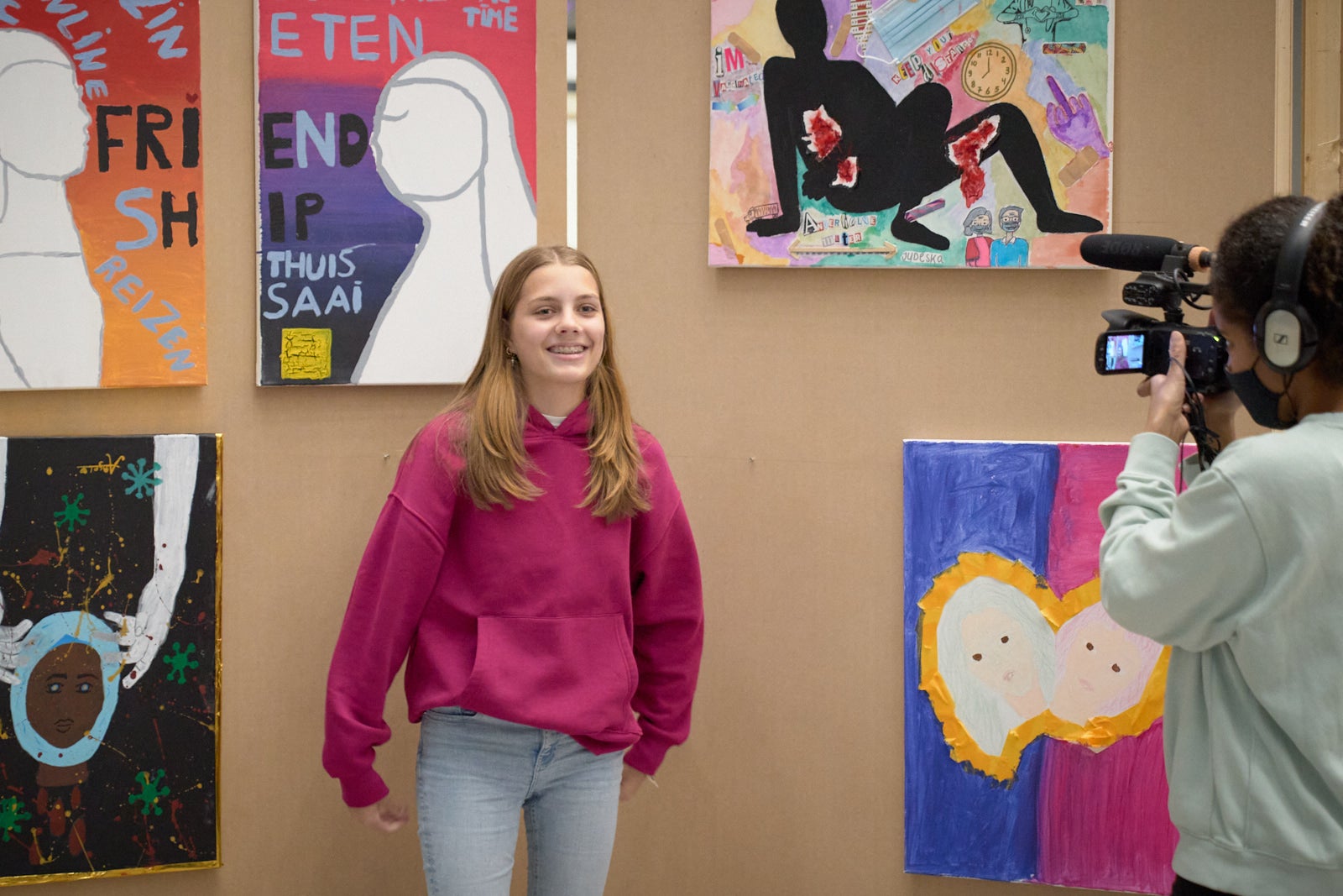 A student presents her artwork.