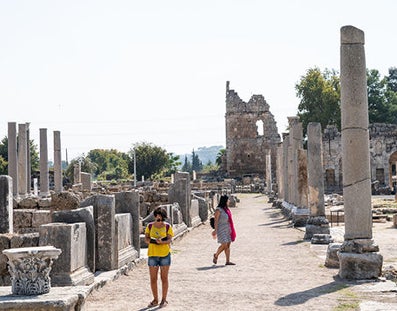  Woman walks around archaeological site