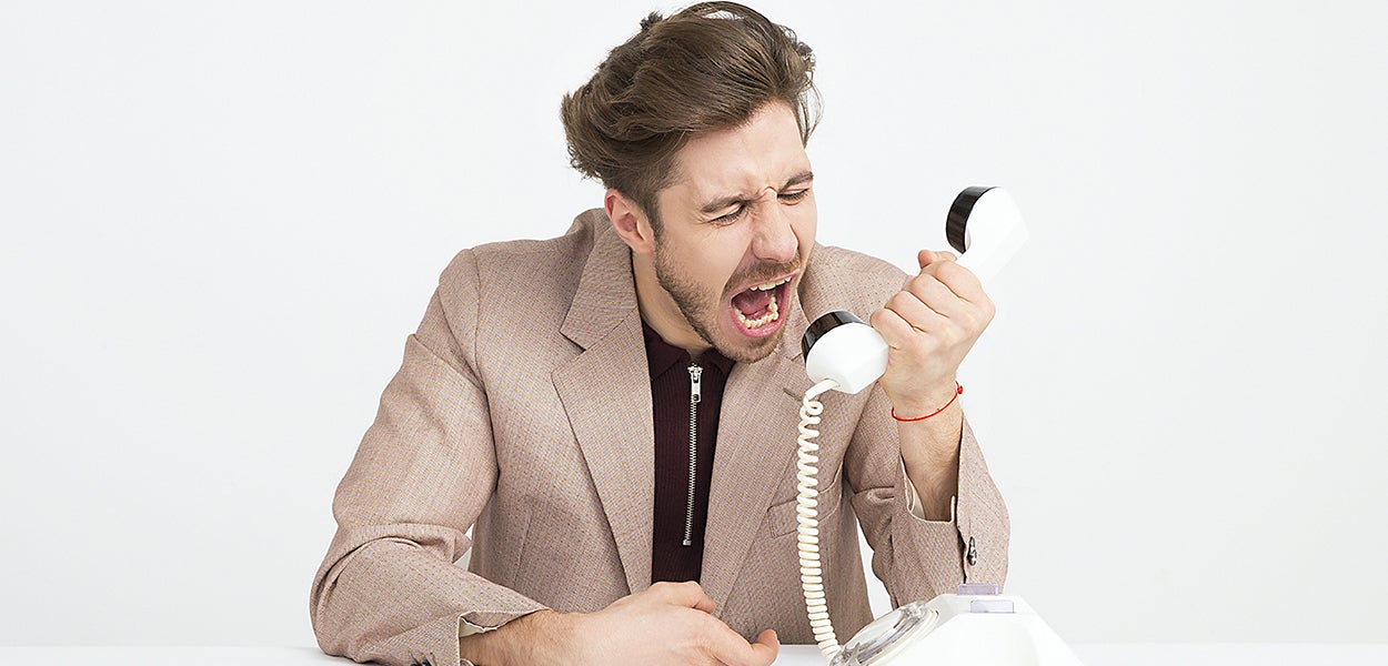 Angry customer shouts his frustrations through the telephone.