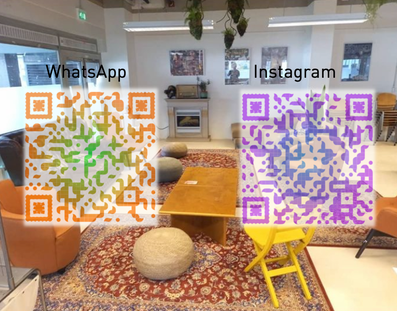 The photo shows QR codes for a whatsapp group and an instagram page